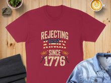 Load image into Gallery viewer, Maroon t-shirt with "Rejecting Kings Since 1776" text and American flag design.