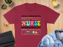 Load image into Gallery viewer, T-shirt with nurse-themed text including "NURSE," "COMPASSIONATE," and medical terms.