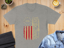 Load image into Gallery viewer, Grey t-shirt with distressed US flag and "We the People" text.