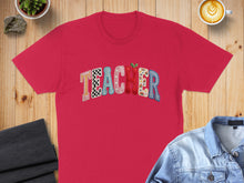 Load image into Gallery viewer, Red t-shirt with colorful "TEACHER" text in checkerboard, polka dot, and striped patterns.