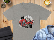 Load image into Gallery viewer, Gray t-shirt with "The Cool Dad" text and mountain graphic.