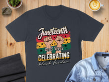 Load image into Gallery viewer, Juneteenth shirt with fists, chains, and "Celebrating Black Freedom" text.