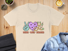 Load image into Gallery viewer, Cream t-shirt with peace sign, heart, stethoscope, and syringe graphic.