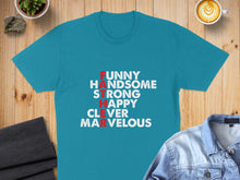 Load image into Gallery viewer, Turquoise t-shirt with "FUNNY HANDSOME STRONG HAPPY CLEVER MARVELOUS" text.