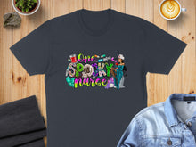 Load image into Gallery viewer, Dark grey t-shirt with "One Spooky Nurse" graphic featuring medical Halloween elements.