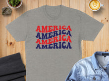 Load image into Gallery viewer, Grey t-shirt with red and blue "AMERICA AMERICA AMERICA" text.