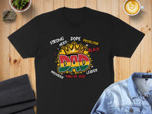 Load image into Gallery viewer, Black t-shirt with "DAD" text, crown, and words "Strong Hero Dope Protector Black Leader Provider Man of God."