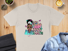 Load image into Gallery viewer, T-shirt with colorful "You RN Good Hands" text and a nurse graphic with butterflies.