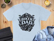 Load image into Gallery viewer, Biker Dad graphic with motorcycle, wings, and skull on a light blue t-shirt.
