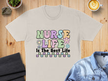 Load image into Gallery viewer, T-shirt with "Nurse Life is the Best Life" text and colorful graphics.