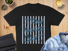 Load image into Gallery viewer, Black t-shirt with "Tired Teachers Club" text on striped background.