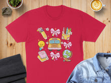 Load image into Gallery viewer, Red t-shirt with colorful back-to-school graphics including a bus, globe, and lightbulb.
