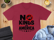 Load image into Gallery viewer, Maroon t-shirt with black text reading "NO KINGS IN AMERICA" and stars.