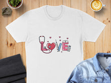 Load image into Gallery viewer, White t-shirt with stethoscope, heart, syringe, and medical symbols forming "love".