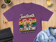 Load image into Gallery viewer, Purple t-shirt with Juneteenth design of chained fists and colorful background.