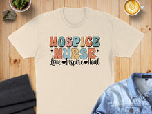 Load image into Gallery viewer, T-shirt with "Hospice Nurse Love Inspire Heal" in colorful retro text.