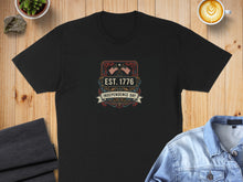 Load image into Gallery viewer, Black t-shirt featuring "Est. 1776 Independence Day" with decorative flags.