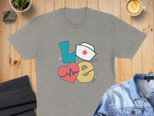 Load image into Gallery viewer, Grey t-shirt with "Love" spelled out in medical icons: heart, stethoscope, nurse hat.