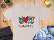 Load image into Gallery viewer, Beige t-shirt with "Peace love Pharmacy" text, peace sign, heart, and pills.
