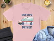 Load image into Gallery viewer, Light pink t-shirt with cartoon ambulance and "Wee Woo Driver" text.