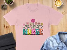 Load image into Gallery viewer, Pink t-shirt with colorful floral "NURSE" text design.