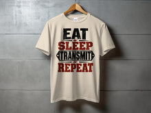 Load image into Gallery viewer, Cream t-shirt with "Eat Sleep Transmit Repeat" graphic in black and red.