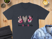 Load image into Gallery viewer, Dark gray t-shirt with peace sign, heart, stethoscope, and syringe graphic.