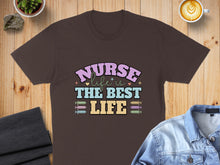 Load image into Gallery viewer, Brown t-shirt with "Nurse is the best life" text and medical icons.
