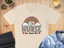 Load image into Gallery viewer, Cream t-shirt with "NURSE Love Inspire Heal" text and rainbow stethoscope graphic.