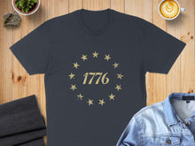 Load image into Gallery viewer, Dark t-shirt with distressed circle of stars and "1776" text.