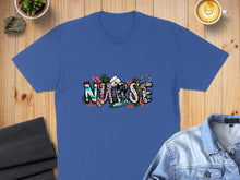 Load image into Gallery viewer, Blue t-shirt with "NURSE" text featuring stethoscope and floral accents.