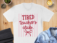 Load image into Gallery viewer, White t-shirt with "Tired Teachers Club" and a bow graphic.