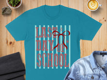 Load image into Gallery viewer, Teal t-shirt with "LAST DAY OF SCHOOL" in red lettering and a red bow.