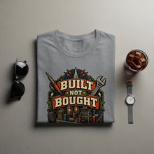 Load image into Gallery viewer, Grey t-shirt with "Built Not Bought" graphic featuring tools and vacuum tubes.