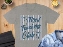 Load image into Gallery viewer, Gray t-shirt with "Tired Teachers Club" text on striped background.