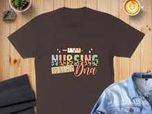Load image into Gallery viewer, Dark brown t-shirt with "NURSING IS IN MY DNA" text and syringe graphics.