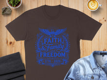 Load image into Gallery viewer, Brown t-shirt with blue "Faith and Family and Freedom 1776-2026" graphic.