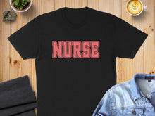 Load image into Gallery viewer, Black t-shirt with "NURSE" in coral lettering, laid flat.