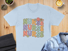 Load image into Gallery viewer, Light blue t-shirt with "Nurse Nurse Nurse" text in retro font and floral accents.