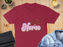 Load image into Gallery viewer, Burgundy t-shirt with "Blessed Nurse" in bubbly, retro font and small stars.