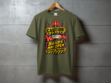 Load image into Gallery viewer, Olive green t-shirt with "Caution: Bands May Open Without Warning" graphic.
