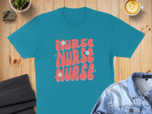 Load image into Gallery viewer, Teal t-shirt with "NURSE NURSE NURSE" text and floral accents.