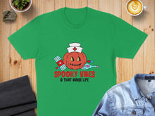 Load image into Gallery viewer, Green t-shirt with a Halloween pumpkin dressed as a nurse.