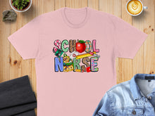 Load image into Gallery viewer, Pink t-shirt with colorful "SCHOOL NURSE" text and school supply graphics.