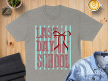 Load image into Gallery viewer, Gray t-shirt with "Last Day of School" text and red bow.