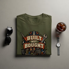 Load image into Gallery viewer, Olive green t-shirt with "Built Not Bought" text and electronic components graphic.