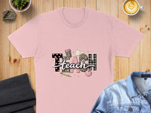 Load image into Gallery viewer, Pink t-shirt with "TEACH" spelled out in patterned letters and school icons.