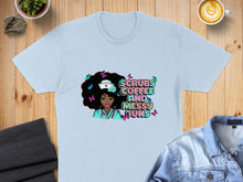 Load image into Gallery viewer, Light blue t-shirt with "Scrubs Coffee and Messy Buns" text and nurse graphic.