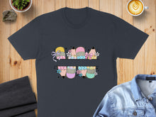 Load image into Gallery viewer, T-shirt with split graphic of colorful pencils and bows with floral accents.