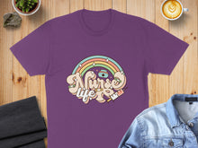 Load image into Gallery viewer, Purple t-shirt with "Nurse Life" text, rainbow, and syringe graphic.
